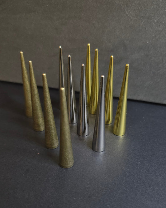 multi colored spikes standing on a black background