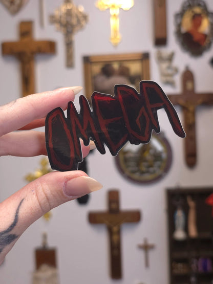 Hand holding a 'OMEGA' sign in front of religious decor