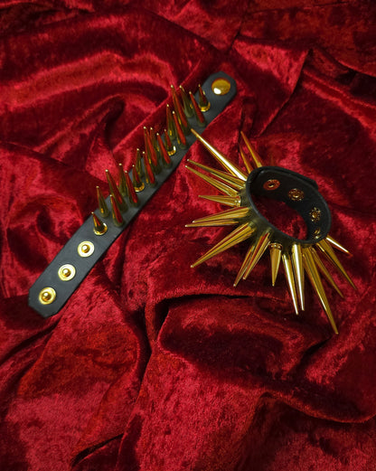 Spiked leather accessory on a red textured background