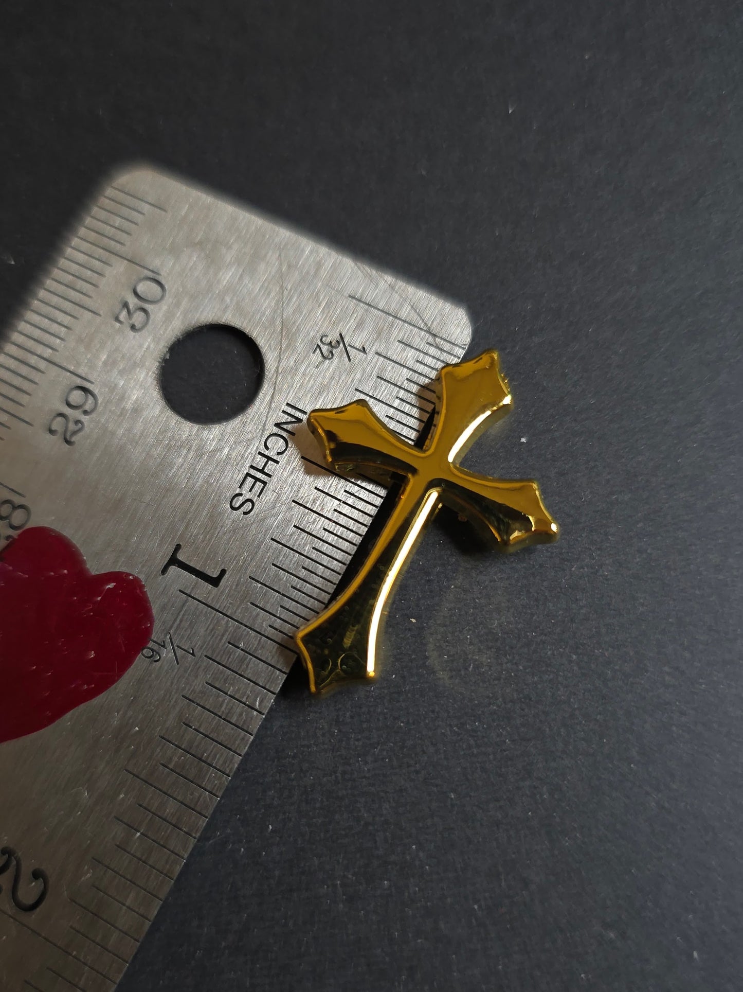 gold cross on ruler 