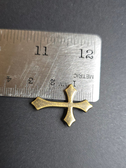 bronze cross on ruler