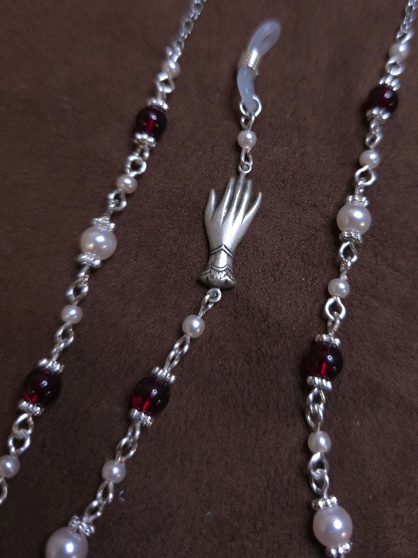 Beaded chain with silver hand charm